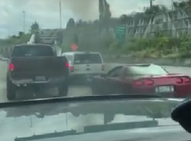 Corvette Driver Tries to Block Truck — Ends Up Covered in Black Smoke